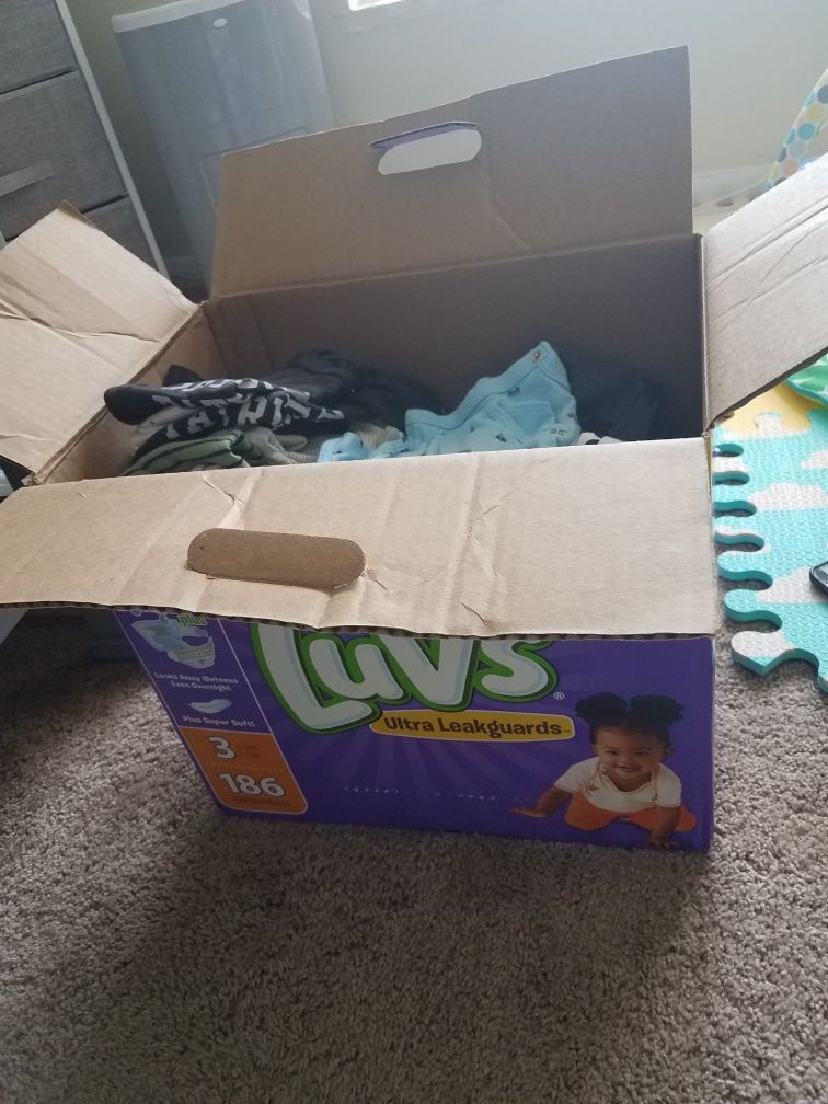 Box of gently used baby boy clothes