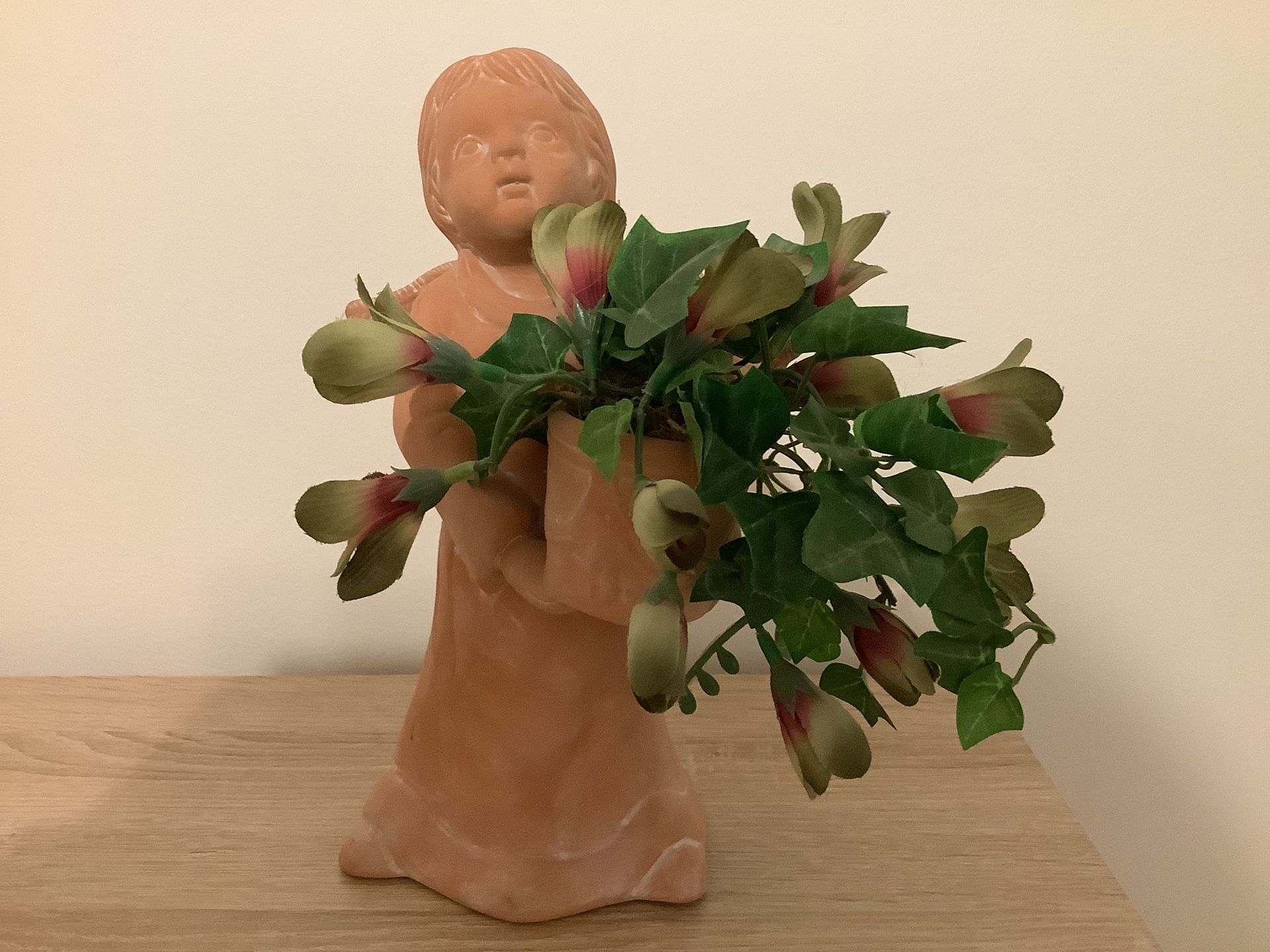 Angel Holding Artificial Greenery