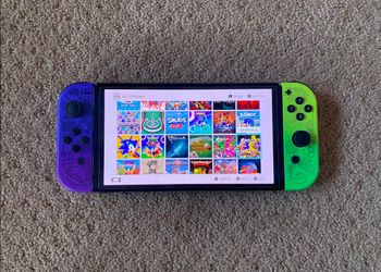 Nintendo Switch OLED + 100 SWITCH GAMES and 7500 Retro Classic Games