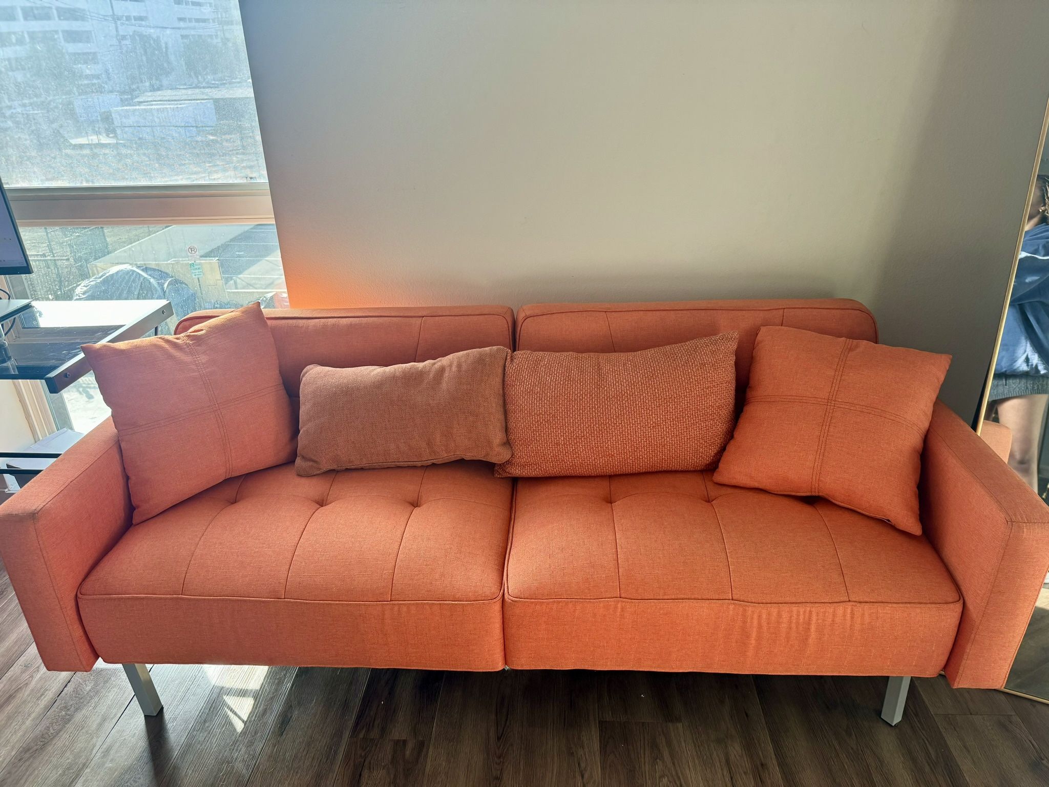 Orange Futon couch - Lays Down As Bed 