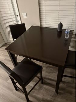 High top tables with 4 cushion chairs