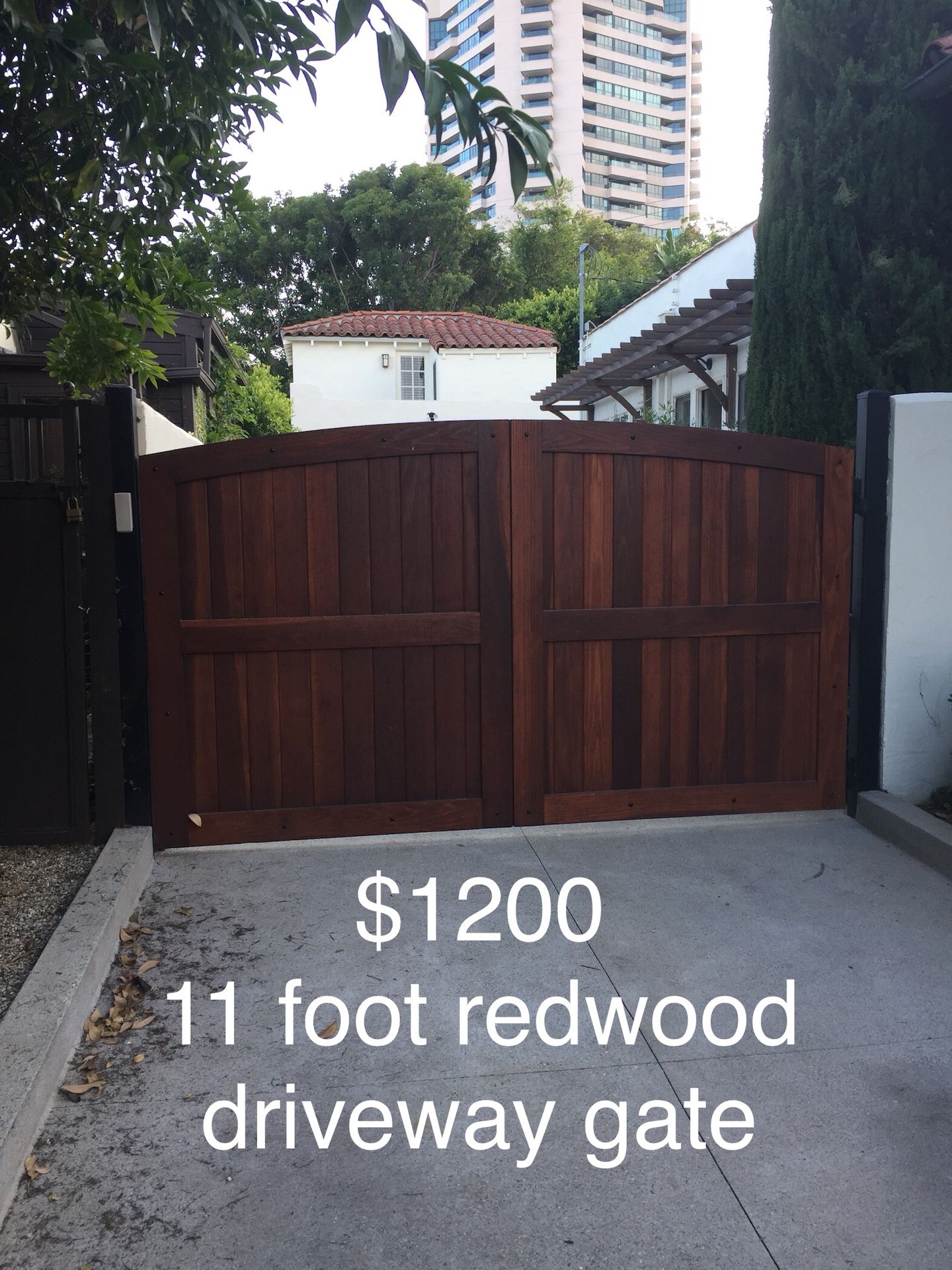 Driveway gate made of metal frame and redwood. 64” height on the sides and 70” at the middle by 131” wide with the posts. It’s in perfect condition
