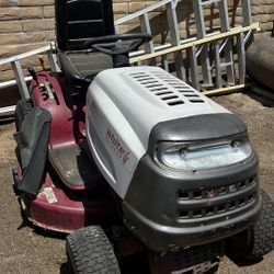 White outdoor riding lawnmower 