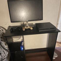 PS4 With Table Controllers Cables And The Monitor 