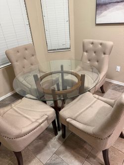 Round glass dining table and chairs
