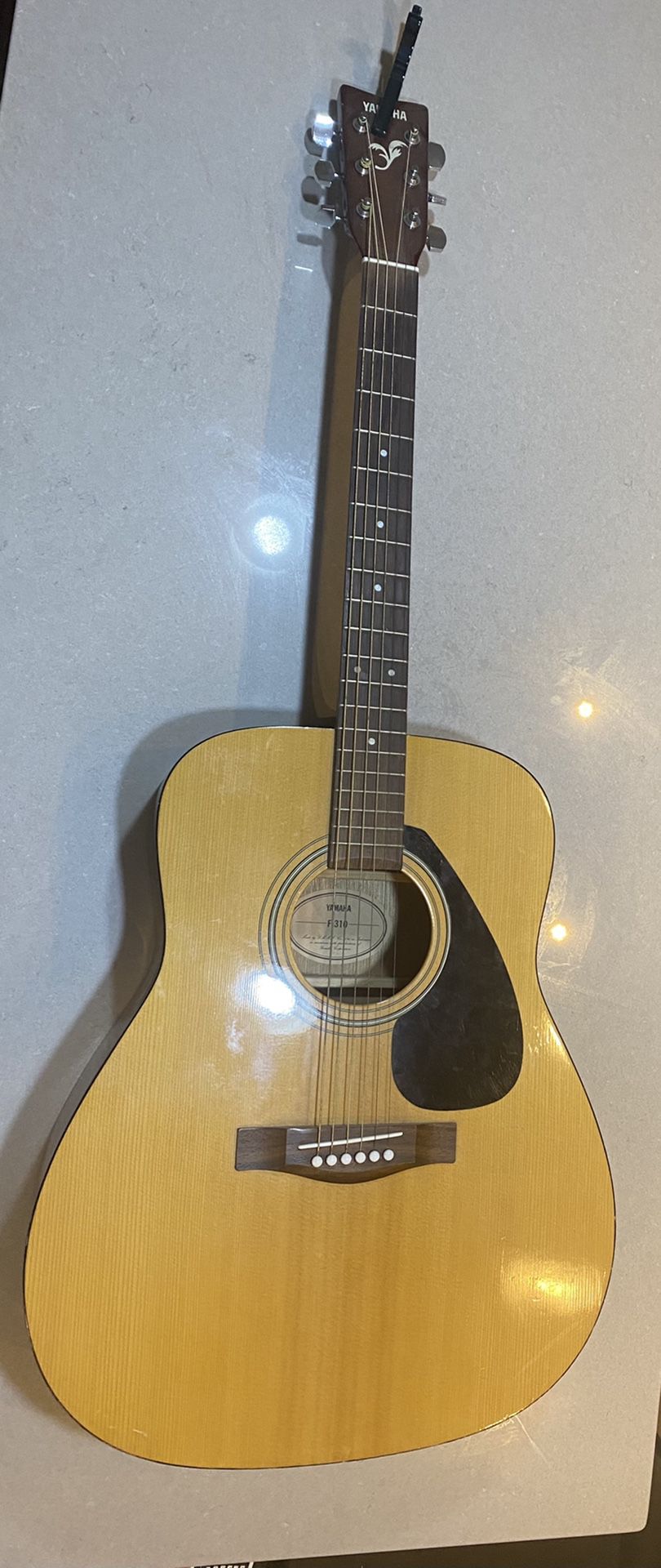 Used F310 Yamaha Acoustic Guitar plus black metal Trigger Acoustic Capo