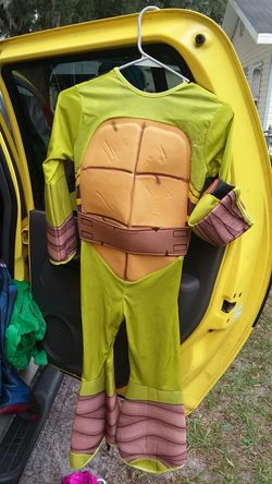 Ninja Turtle costume looks like maybe 10 to 12