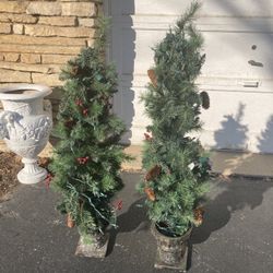 Two matching holiday outdoor trees 