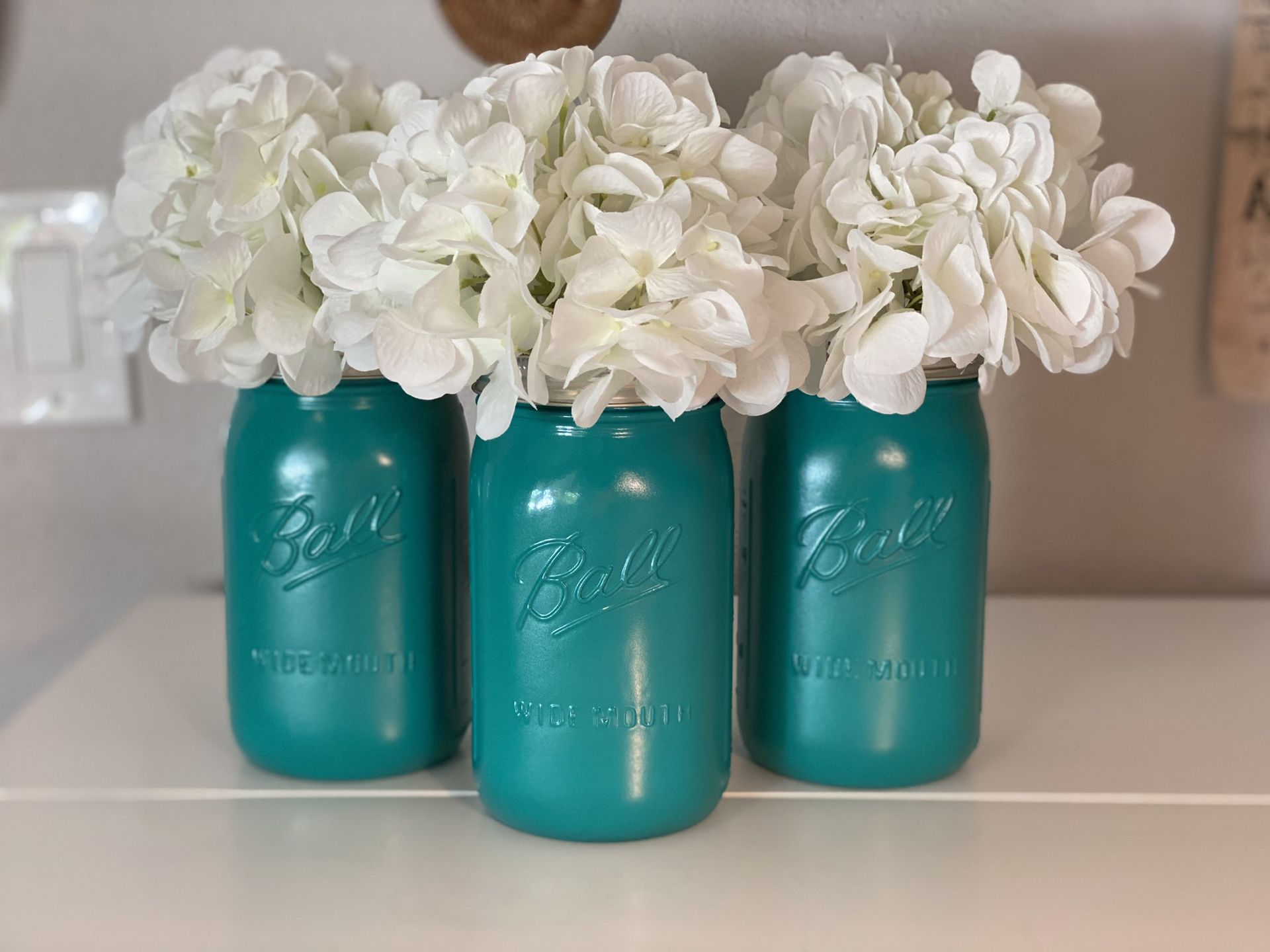 Set of three hand painted mason jars