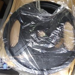 300lb Olympic weight set with 700lb Rated Olympic barbell with clips!