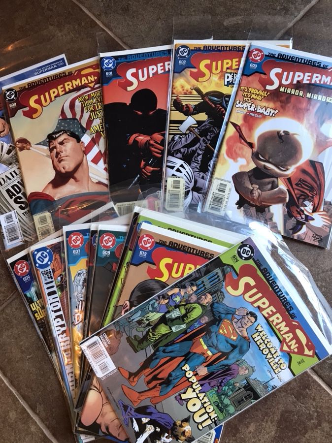 48 Superman comics in bags with boards