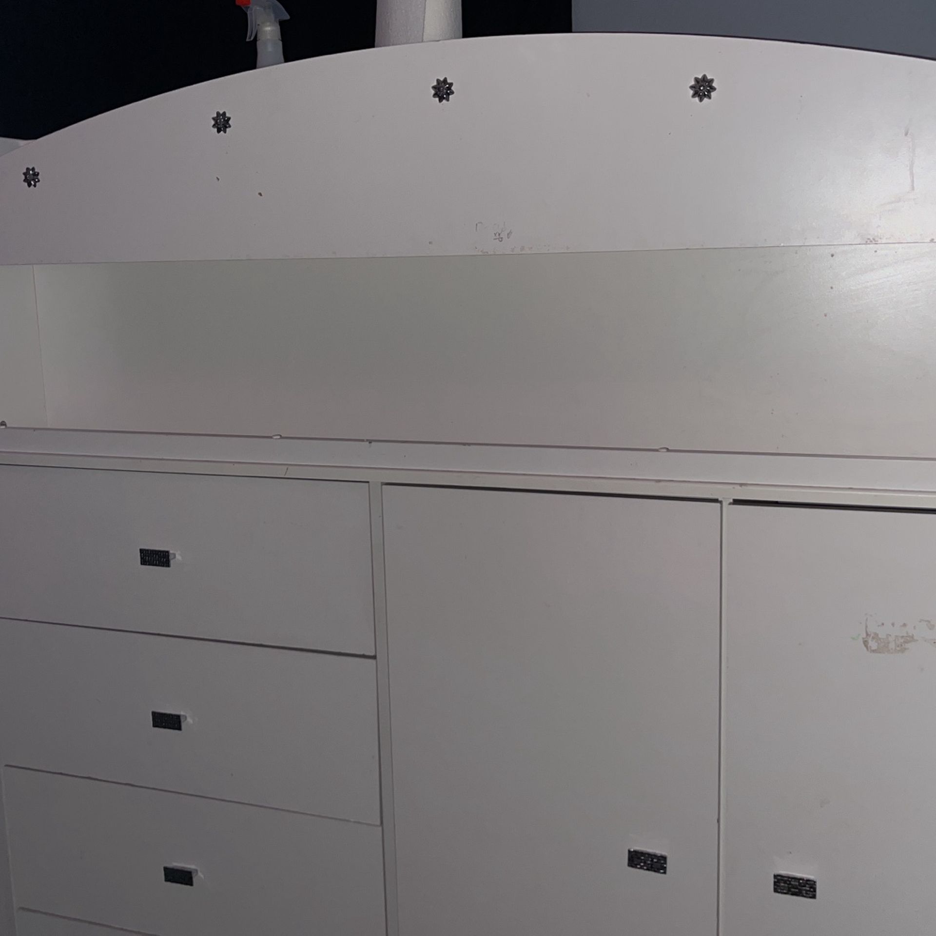 White twin princess bed white coquette bed 4 drawers, 1 closet, hideout, desk, and shelves.