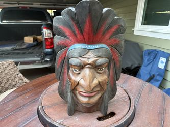 mahogany carved Indian head was bought in Lawton, OK in 1962 at a Choctaw Indian craft fair 22 inches tall by 17 wide