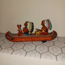 vintage "Tom Tom Indian" friction canoe toy