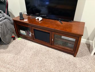 Wood TV stand with glass doors