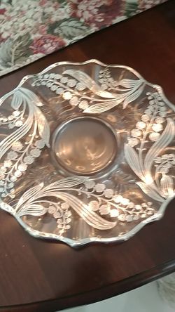 Antique glass serving dish with sterling silver edges and inlaid design. Excellent condition!