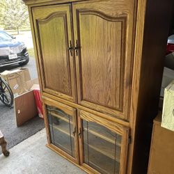 NEED GONE BEAUTIFUL ALL WOOD CHINA CABINET WITH GLASS AND COLLAPSING DOORS