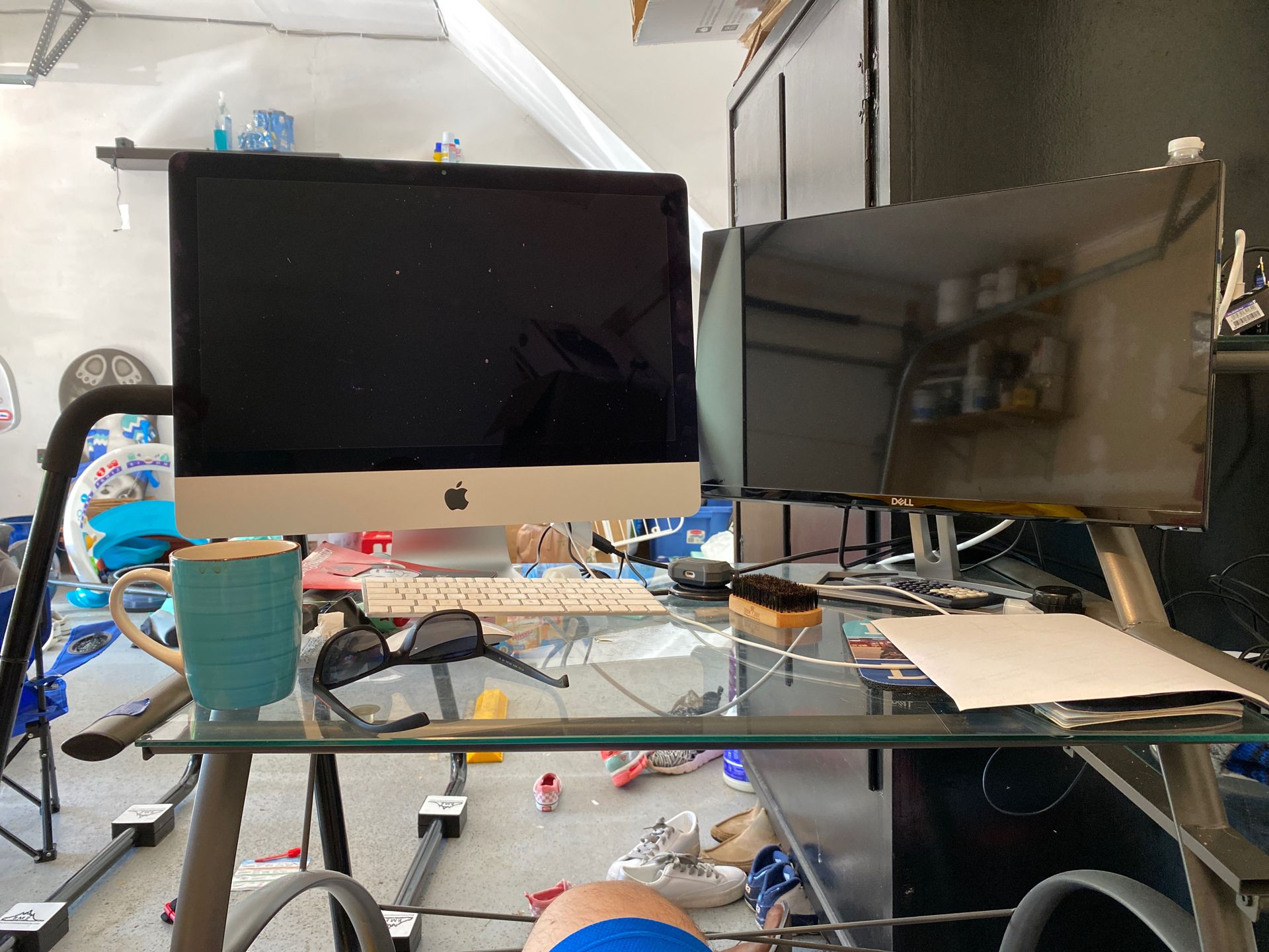 Glass work desk with attached shelving