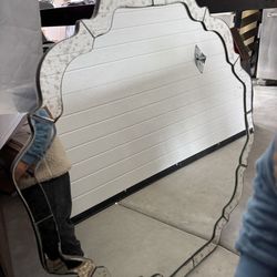 stunning decorative Venetian-style scalloped wall mirror featuring beveled edges and reverse etched details