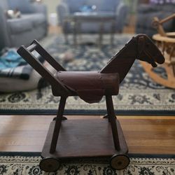 Antique wooden children push on wheels horse toy