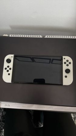 Nintendo Switch comes with charger and bunch of games.