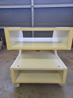 TV/ Gaming console stand with rolling wheels
