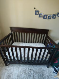 Fisher Price Dark brown crib and mattress
