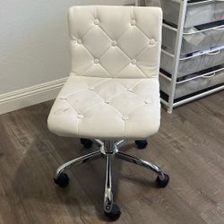 Desk Chair On Wheels.  Small Stain. 