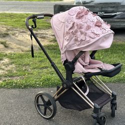 Cybex priam pale blush seat pack and jeremy scott wings carry cot with frame