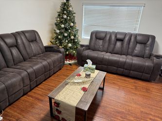 2 recliner sofas and 1 recliner chair apostolic Brown Faux leather, wipe clean, each sofa / chair has 2 cup holders on the arms, middle of the sofa