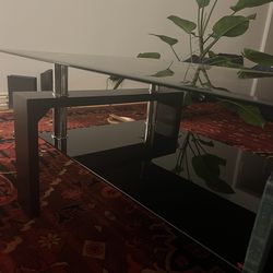 Black glass and dark wood coffee table - excellent condition.
