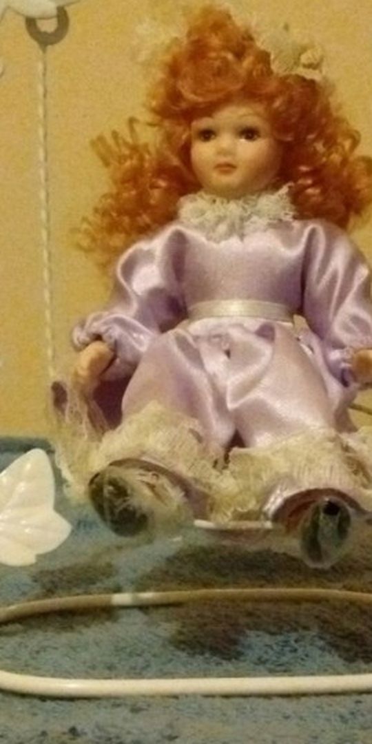 ANTIQUE DOLL MADE ON A SWING