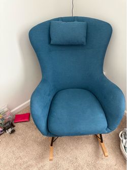 Teal rocking chair with wooden legs