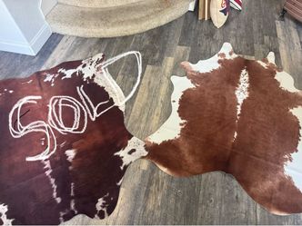 2 Large Faux cow Hyde Rugs