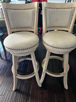 Swivel barstools with nailheads