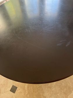 54” round black solid wood table