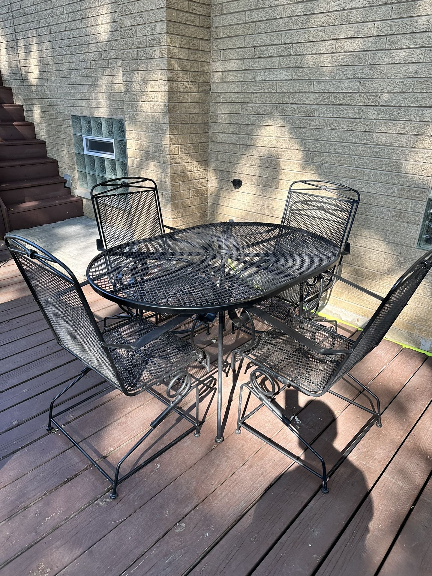 2 Wrought Iron Patio Sets, 2 Tables, 8 Bouncy Chairs, 1 Umbrella And Stand, 4 Chairs Cushions