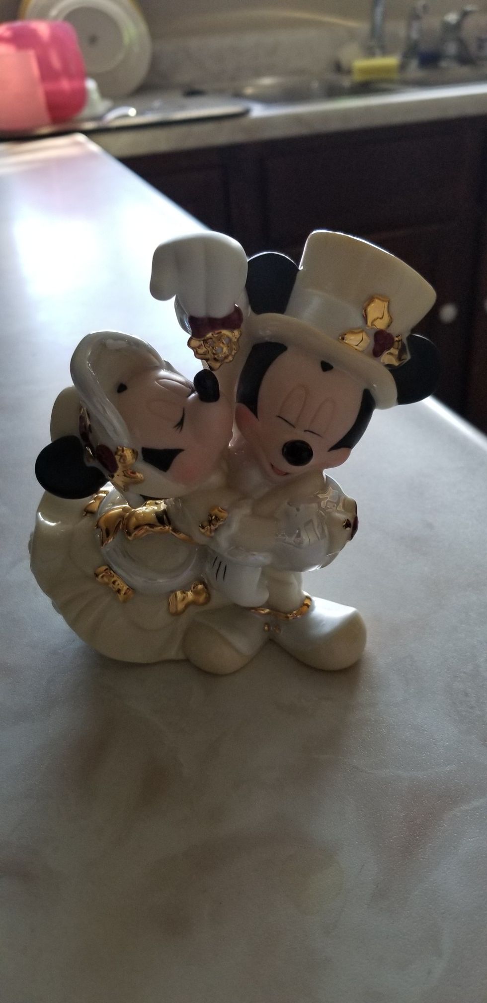 Mickey and Minnie Christmas under mistletoe