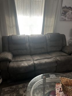 Sofa with recliner seats on each end.