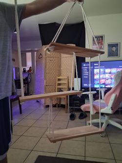 This is a 3 tier hanging rope wall shelf