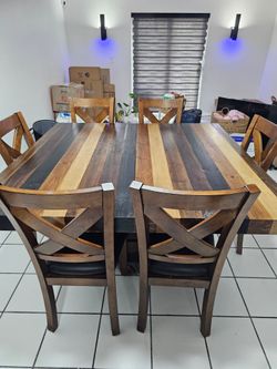 Rectangular dining table with six chairs, seating six people