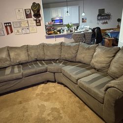 Grey curved sectional sofa