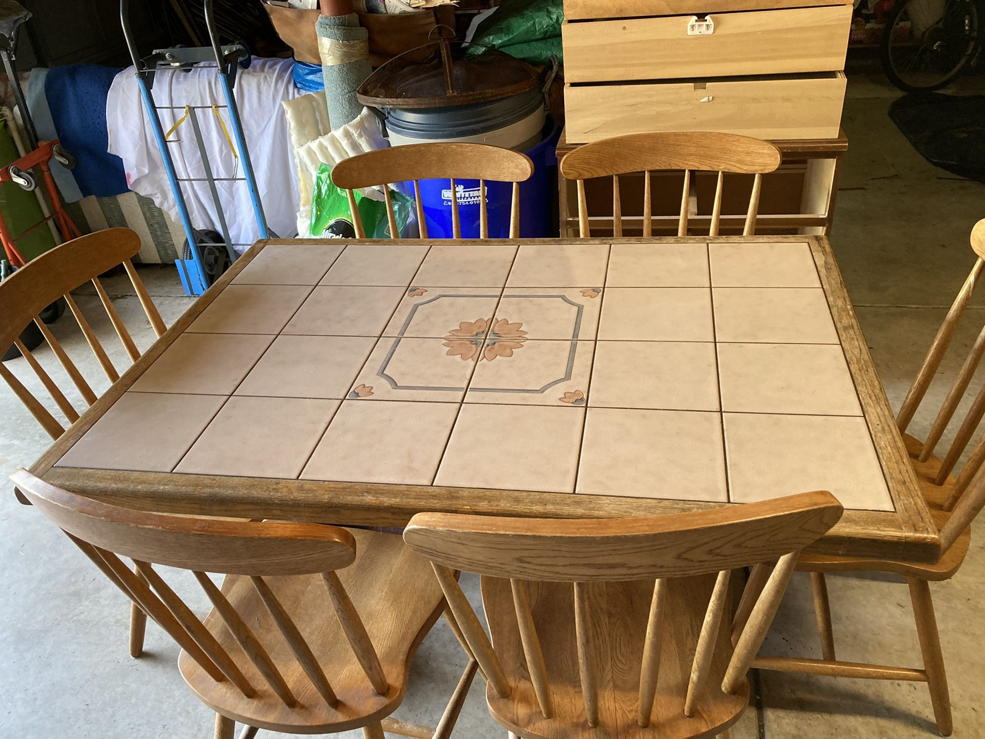 Kitchen Table With Mosaic Tiles And Six Chairs