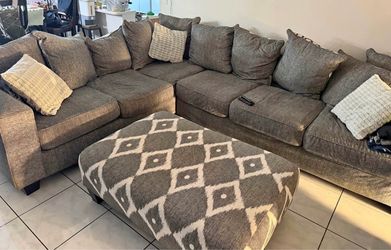 Grey sectional couch with ottoman