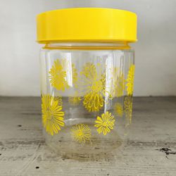 Vintage 1970s Corning Glass Yellow Daisy Canister with Tight Seal Lid. 6” tall. Yellow Daisy pattern is bright and shiny. Lid fits snug. 