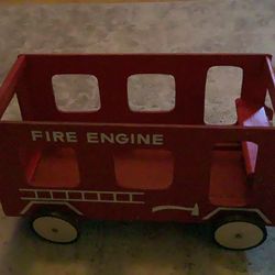 Vintage wood fire truck has wheels great for storing books ,toys etc.