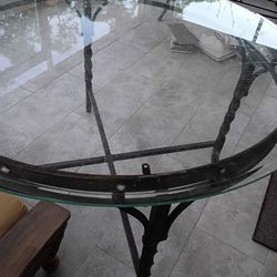 Round glass table with metal frame