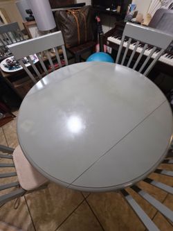Gray drop-leaf table with 4 matching chairs!