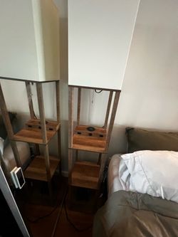 2 Tall lamps with shelves, mag safe charging, and charging outlets