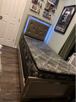 Twin bed frame with mattress and box spring